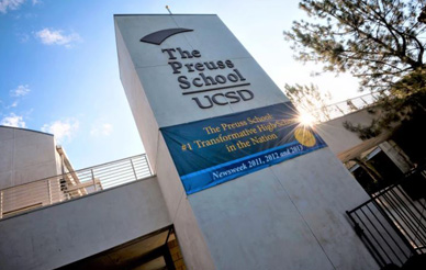 An image of the front of The Preuss School with the sun shining.