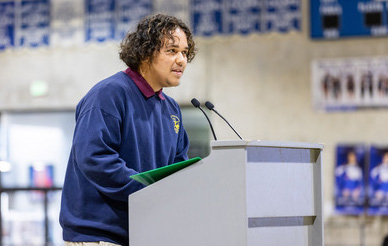 A Preuss student speaks at a podium during a special talk by Martin Luther King III.