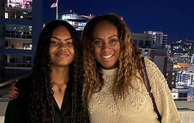 Preuss student Jasmine Matthews poses with her award on the rooftop of a downtown building during the recognition event alongside her counselor, Alyson Cobbs.
